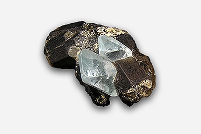 A fragment of topaz on quartz.