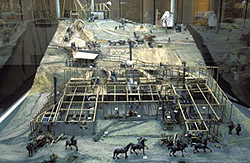 Close up view of the model of the Port Phillip & Colonial Gold Mining Company at Clunes, showing people and horses working on the site.