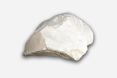 A fragment of kaolin which is white in colour.
